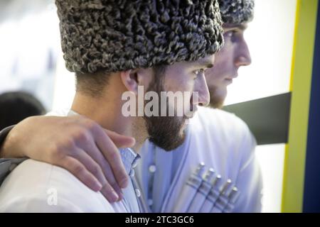 Moscow, Russia. 10th of December, 2023. Men wearing traditional costumes are seen at the opening of Chechen Republic Day during the Russia Expo international exhibition and forum at the VDNKh exhibition centre in Moscow, Russia. Credit: Nikolay Vinokurov/Alamy Live News Stock Photo