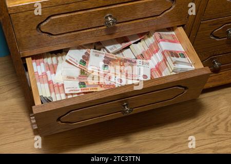 Savings in Russian rubles of five thousand each, stored in an old closet. A large amount of money in cash. Stock Photo