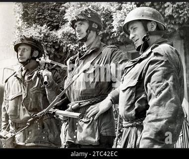 NORMANDY LANDINGS June 1944. Members of the Glider infantry of D Company, 2nd Battalion Ox and Bucks Light Infantry of the 6th Airlanding Brigade, 6th Airborne Division. Their  unit captured 'Pegasus Bridge' the bridge over the Caen Canal at Benouville on 6th June. At centre is Captain Brian Priday who was John Howard's second in command. Stock Photo