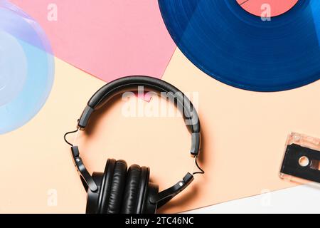 Background, old retro vinyl records, headphones and an audio cassette Stock Photo