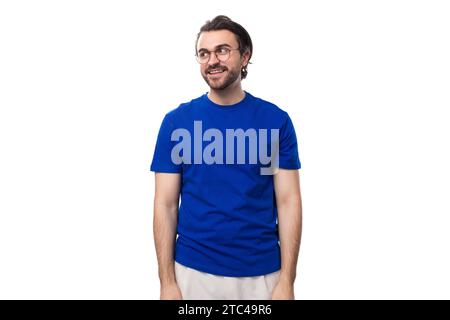 young well-groomed brunette man with a beard in a t-shirt with a brand mockup Stock Photo