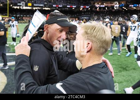 New Orleans, Louisiana, USA. 10th Dec, 2023. (left to right) New Orleans Saints head coach Dennis Allen hugs Carolina Panthers interim head coach Chris Tabor after their NFL regular season game in New Orleans, Louisiana USA on December 10, 2023. The Saints beat the Panthers 28-6. (Credit Image: © Dan Anderson/ZUMA Press Wire) EDITORIAL USAGE ONLY! Not for Commercial USAGE! Credit: ZUMA Press, Inc./Alamy Live News Stock Photo