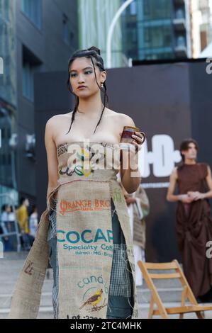 A female model wearing a burlap coffee bag dress walks the runway at the Par Danika fashion show in Montreal,Quebec,Canada Stock Photo