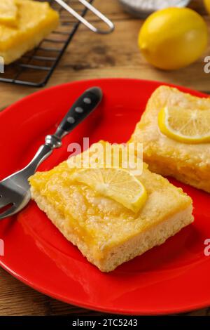 Plate With Delicious Lemon Pie Bars And Cup Of Tea On Table Stock Photo 