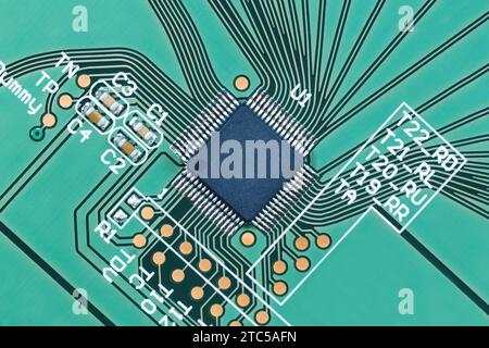 Microprocessor on a green printed circuit board close-up, top view. Macro photography Stock Photo