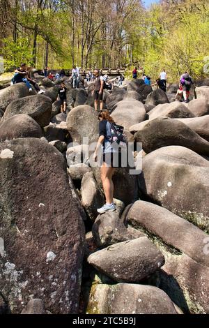 Lautertal, Germany - April 24, 2021: Large rocks on hill near bridge at Felsenmeer on a spring day in Germany. Stock Photo