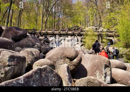 Lautertal, Germany - April 24, 2021: Bridge over rocks on hill at Felsenmeer on a spring day in Germany. Stock Photo