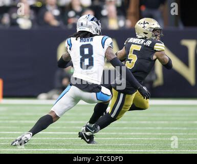 New Orleans, USA. 10th Dec, 2023. New Orleans Saints wide receiver Lynn Bowden Jr. (5) tries to get past Carolina Panthers cornerback Jaycee Horn (8) for some yards after the catch during a National Football League game at Caesars Superdome in New Orleans, Louisiana on Sunday, December 10, 2023. (Photo by Peter G. Forest/Sipa USA) Credit: Sipa USA/Alamy Live News Stock Photo