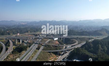 Enshi, China. 11th Dec, 2023. An aerial photo is showing a high-speed loop line in the mountains in Enshi City, Hubei Province, China, on December 7, 2023. (Photo by Costfoto/NurPhoto) Credit: NurPhoto SRL/Alamy Live News Stock Photo