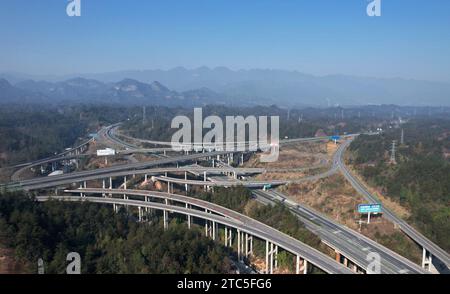 Enshi, China. 11th Dec, 2023. An aerial photo is showing a high-speed loop line in the mountains in Enshi City, Hubei Province, China, on December 7, 2023. (Photo by Costfoto/NurPhoto) Credit: NurPhoto SRL/Alamy Live News Stock Photo
