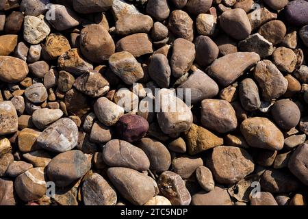 Close-up shot with gravel stones, pebbles as a background. Stock Photo