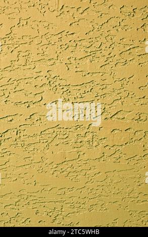 Front view of mustard yellow colored abstract pattern concrete wall Stock Photo