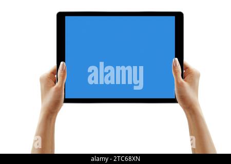 Female hands holding tablet with blank screen isolated Stock Photo