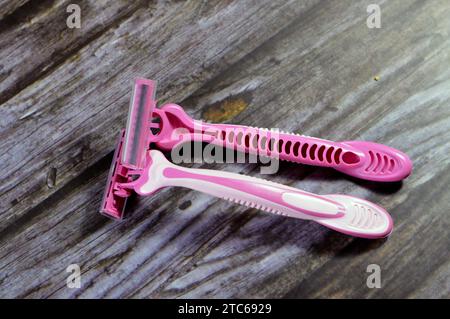 Three blade razor system, smooth shaving, female shaving platform, pink shaving blades for women, triple Plus cart machine 3 blades, disposable razors Stock Photo