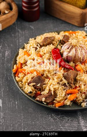 Large dish with Uzbek festive pilaf plov Stock Photo