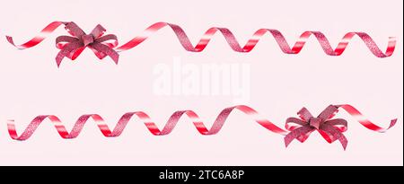 Gift Red Bow and ribbons Isolated on pink background with clipping path, holiday decorations. Stock Photo
