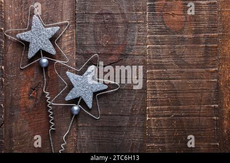 Old wooden background with Christmas decorations in a rustic style. Stock Photo