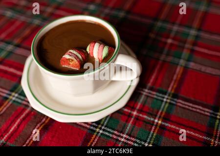 hot chocolate with marshmallows on christmas tablecloth Stock Photo