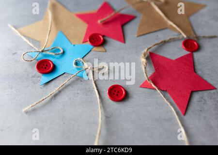 flat lay of craft materials paper red buttons and string Stock Photo