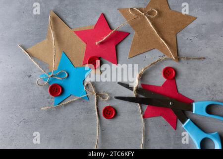 flat lay of crafting materials with string paper buttons and scissors Stock Photo