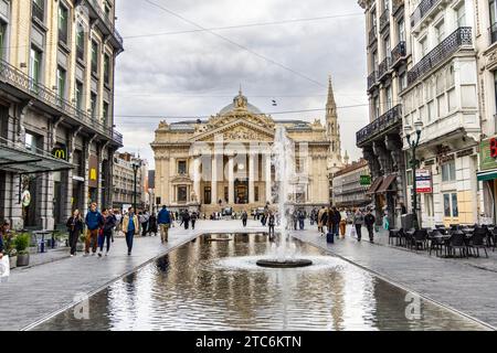 Exterior of the former Brussels Stock Exchange building and fountain at Rue Auguste Orts, Brussels, Belgium Stock Photo