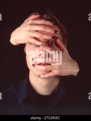 Hands covering face Stock Photo