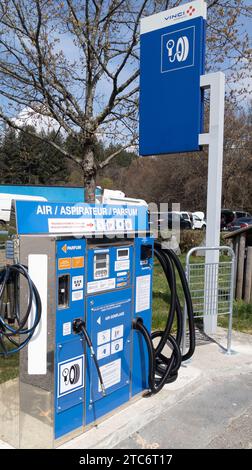 Lyon , France - 11 07 2023 : vinci autoroutes Industrial vacuum cleaner and stationary compressor for inflating wheels at a gas station with car inter Stock Photo