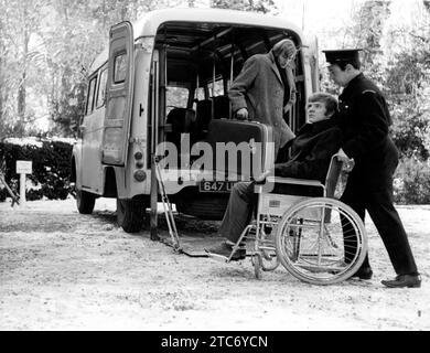 MALCOLM McDOWELL and CHRISTOPHER CHITTELL (with suitcase) in THE RAGING MOON 1971 director / screenplay BRYAN FORBES novel Peter Marshall music Stanley Myers producer Bruce Cohn Curtis EMI Films Stock Photo