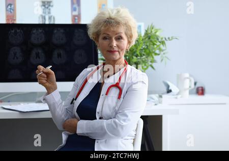 Portrait of elderly woman doctor in field of medicine Stock Photo