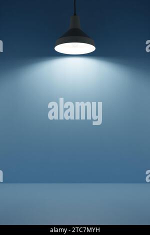 Lamp shines from above on empty podium background, interior design, free space. 3d render Stock Photo