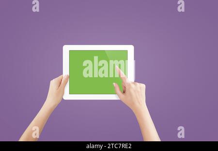 Female hands holding tablet with blank screen isolated Stock Photo