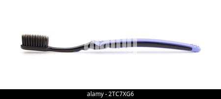 New plastic dental toothbrush isolated on white. Stock Photo