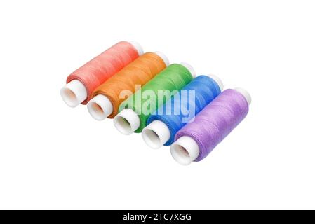 Spool of thread isolated on white background.  Set of different colorful sewing threads , top view Stock Photo