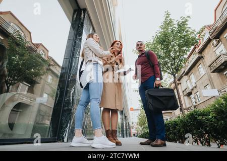 Young Business Professionals Collaborating on a Project in the Urban City. Stock Photo
