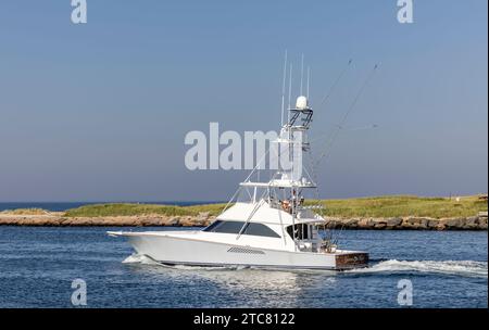 Motor yacht, Gianna Marie heading out of montauk harbor Stock Photo