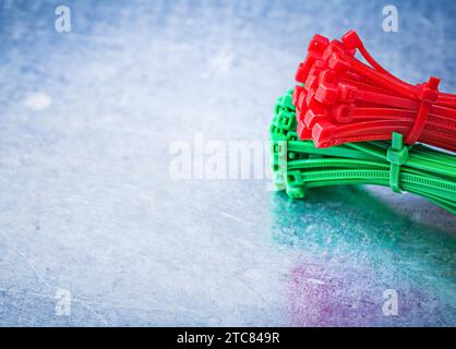 Bunch of self-locking cable ties on metallic background construction concept Stock Photo