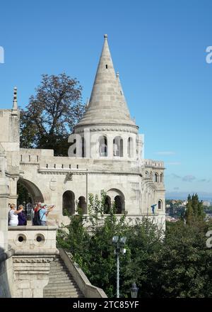 Tourists taking a photo of the view from Fishermans Bastion Budapest Stock Photo