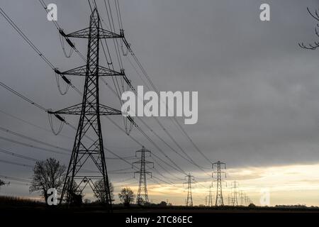 Transmission towers, Electric Pylons, electricity supply, lattice tower, support electric cables, transferring power, high-voltage Stock Photo