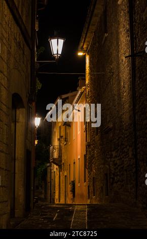 A picture of a narrow street at night, at the top of Mount Titano San Marino Stock Photo