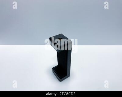 The phone holder is black on a white background Stock Photo