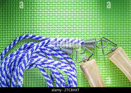 Jumping rope on green surface sports training concept Stock Photo