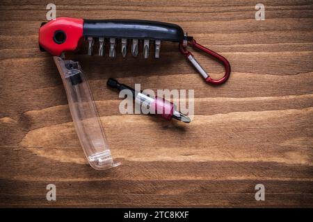 Interchangeable turnscrew bits in toolbox on wood board construction concept Stock Photo