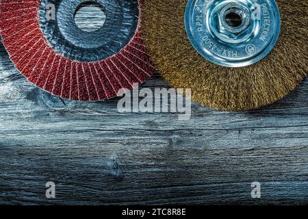 Grinding disc Wire brush on old wooden board Stock Photo