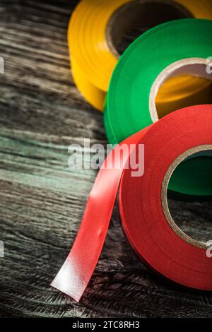 Composition of adhesive tapes on an old wooden board Stock Photo