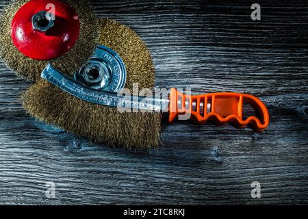 Compilation of used scratching brushes on an old wooden board Stock Photo