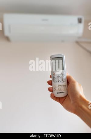 Remote control for controlling the air conditioner using the remote control Stock Photo