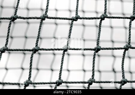 Knot rope mesh closeup abstract black and white isolated background pattern close up Stock Photo