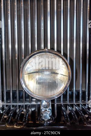 Radiator grille and headlight of retro car close up Stock Photo