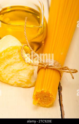 Italian pasta basic food ingredients parmesan cheese and extra virgin olive oil Stock Photo