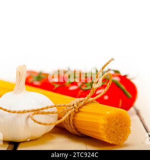Italian basic pasta fresh ingredients cherry tomatoes garlic Stock Photo